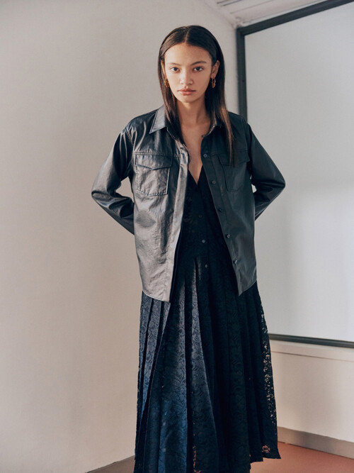 Coated shirt layered with a pleated corded lace dress