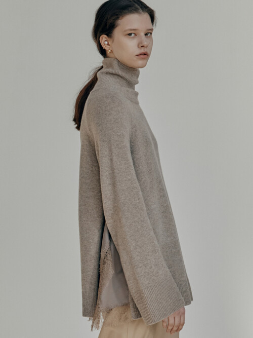 Asymmetric satin panelled wool-blend turtleneck sweater