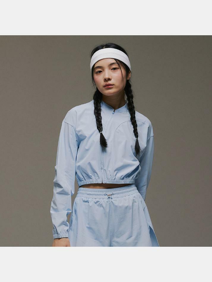 라이트 아크 슬랜트 집업 스카이블루